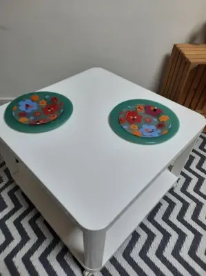 a white table with two plates on top of it at Studio for guests Catherine in Sofia