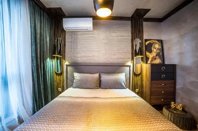 a bedroom with a large bed in a room at Lux Apart Karlovo 1 in Karlovo