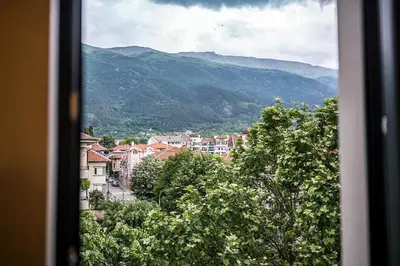 a view from a window of a town with mountains at Lux Apart Karlovo 1 in Karlovo
