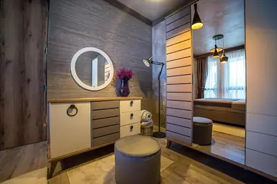 a bathroom with a vanity and a mirror at Lux Apart Karlovo 1 in Karlovo