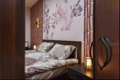 a bedroom with a bed with two pillows on it at Top Center Retreat, Close to Main street, FREE Parking in Sofia