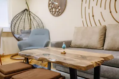 a living room with a table and a couch at Top Center Retreat, Close to Main street, FREE Parking in Sofia