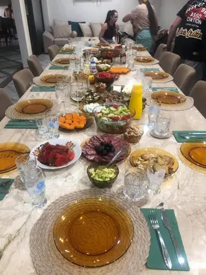 a long table with plates of food on it at Boris House 5 bed Villa & Private Pool in Strumyani