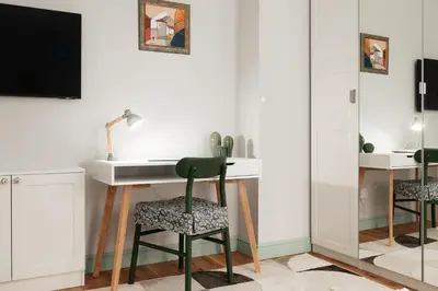 a room with a desk and two chairs at Brand New 2 bdr Luxury Apartment in Top Centre in Sofia