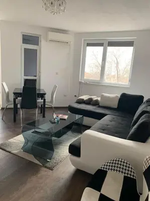 a living room with a couch and a table at Luxury Apartment Eleni in centre of Sandanski in Sandanski