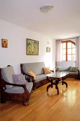 a living room with two couches and a coffee table at Домът на архитекта The Architect's Home in Plovdiv