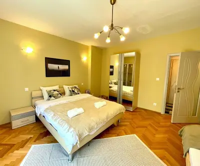 a bedroom with a large bed in a room at Bohemian Bright & Calm 2BR - Top center - Private Balcony in Sofia