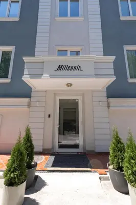 a building with a sign that reads milimini at Millennia Hotel in Sofia