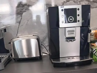 a microwave sitting on a counter next to a toaster at Doble next to Bulgaria mall, FREE underground parking in Sofia