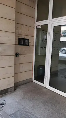 a sliding glass door of a building with a window at Doble next to Bulgaria mall, FREE underground parking in Sofia