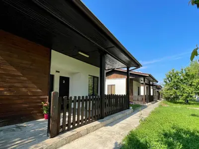 a row of houses with a wooden fence at Bungalows of Yug in Kyustendil
