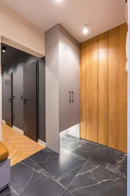 a bathroom with wooden cabinets and a tile floor at Sunset 2BR Apartment Central Street PARKING Included in Plovdiv
