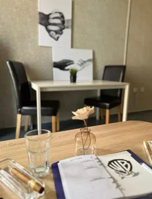 a table with chairs and a table with a tableablishthritisthritisthritisthritisthritis at Flower house 6 in Sofia