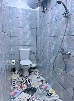 a bathroom with a toilet and a shower at The rainbow 9 in Sofia