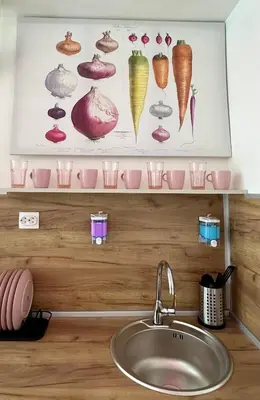 a kitchen counter with a sink and some cups at The rainbow 9 in Sofia