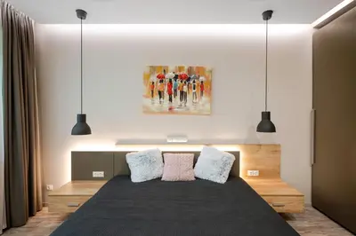 a bedroom with a bed and a painting on the wall at Elegant Escape in The Heart of The City by Flat Mаnager in Sofia