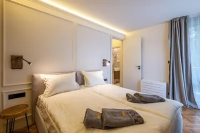 a bedroom with a large bed with a large window at SOFapart Stylish & Fancy Place with 1 BDR in Sofia