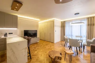 a kitchen and living room with a table and chairs at SOFapart Stylish & Fancy Place with 1 BDR in Sofia