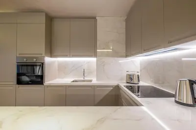 a white kitchen with white cabinets and a sink at SOFapart Stylish & Fancy Place with 1 BDR in Sofia
