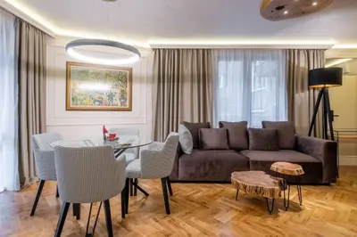 a living room with a couch and a table at SOFapart Stylish & Fancy Place with 1 BDR in Sofia