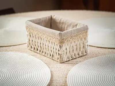 a wicker basket sitting on a table with plates at Стаи за гости Божана in Razlog