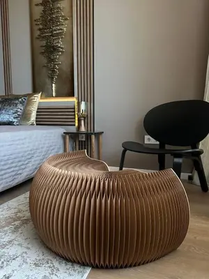 a large wooden ottoman in a bedroom with a chair at Rome Stylish apt w Working Space and Paid Parking Spot in Sofia