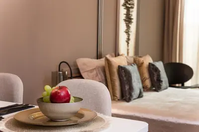 a bowl of fruit sitting on top of a table at Rome Stylish apt w Working Space and Paid Parking Spot in Sofia