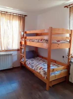 a bedroom with two bunk beds in a room at Sokol i Kalina spa in Pchelin
