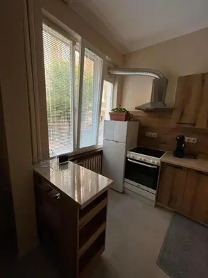 a kitchen with a white refrigerator and a stove at EL apartment in Sofia