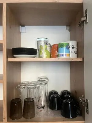 a shelf with glass jars and other items on it at EL apartment in Sofia