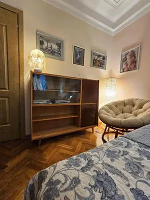 a bedroom with a flat screen tv and a bed at Alex Place-Central Sofia in Sofia