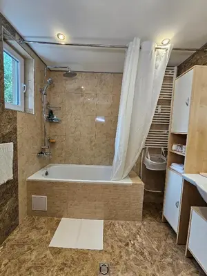 a bathroom with a tub and a shower at Alex Place-Central Sofia in Sofia