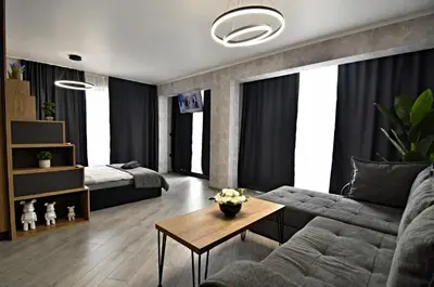 a living room with a couch and a table at Апартамент Жери in Velingrad