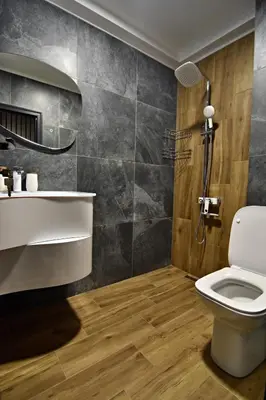 a bathroom with a toilet and a shower at Апартамент Жери in Velingrad