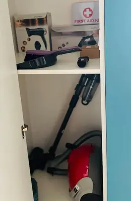 a book shelf with a scooter in a closet at Luxurious apartment 1BDR by Top Kvartiri Ltd in Sofia