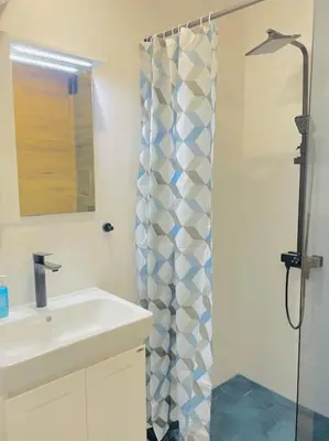 a bathroom with a sink and a shower at Luxurious apartment 1BDR by Top Kvartiri Ltd in Sofia