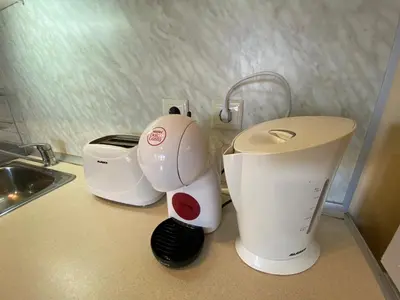 two white blenders sitting on a counter next to a sink at Cozy flat in NEON in Bansko