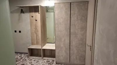 a bathroom with a walk in shower with a mirror at RCR Einstein studios 2 in Sofia