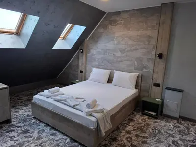 a bedroom with a bed with towels on it at RCR Einstein studios 2 in Sofia