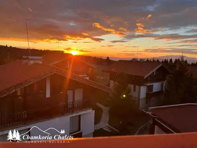 a view of the sunset from the roof of a house at Chamkoria Chalets 409 in Borovets