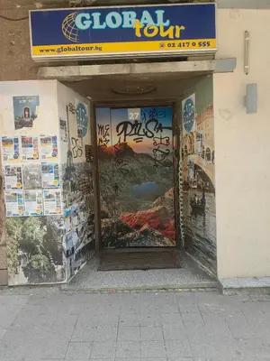 a door to a building with a sign on it at Graf Ignatiev 27 in Sofia