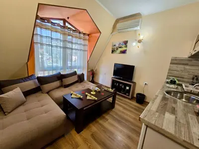 a living room with a couch and a table at Апартаменти Лили in Devin