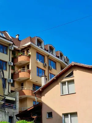 a large building with balconies on the side of it at Апартаменти Лили in Devin