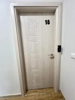 a door with a maze pattern on it at GREEN PARK Apartments and rooms for guests in Asenovgrad