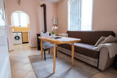 a living room with a table and a couch at Kostenets Hills in Kostenets Village