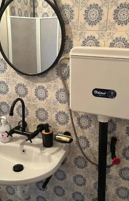 a bathroom with a sink and a mirror at Apartment11in the center of Sofia in Sofia