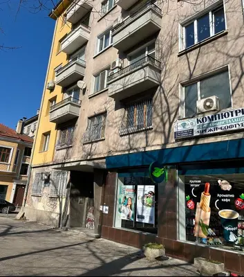 a building with a sign on the side of it at Apartment11in the center of Sofia in Sofia