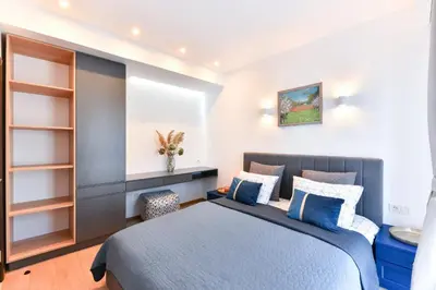 a bedroom with a bed and a sink at Lyana's One Bedroom apartment in Bansko