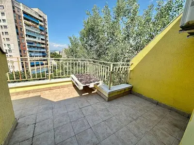 a balcony with a bench on top of a building at Student Town 1BDR APT in Sofia
