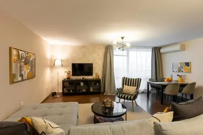 a living room with a couch and a table at My Place in Sofia